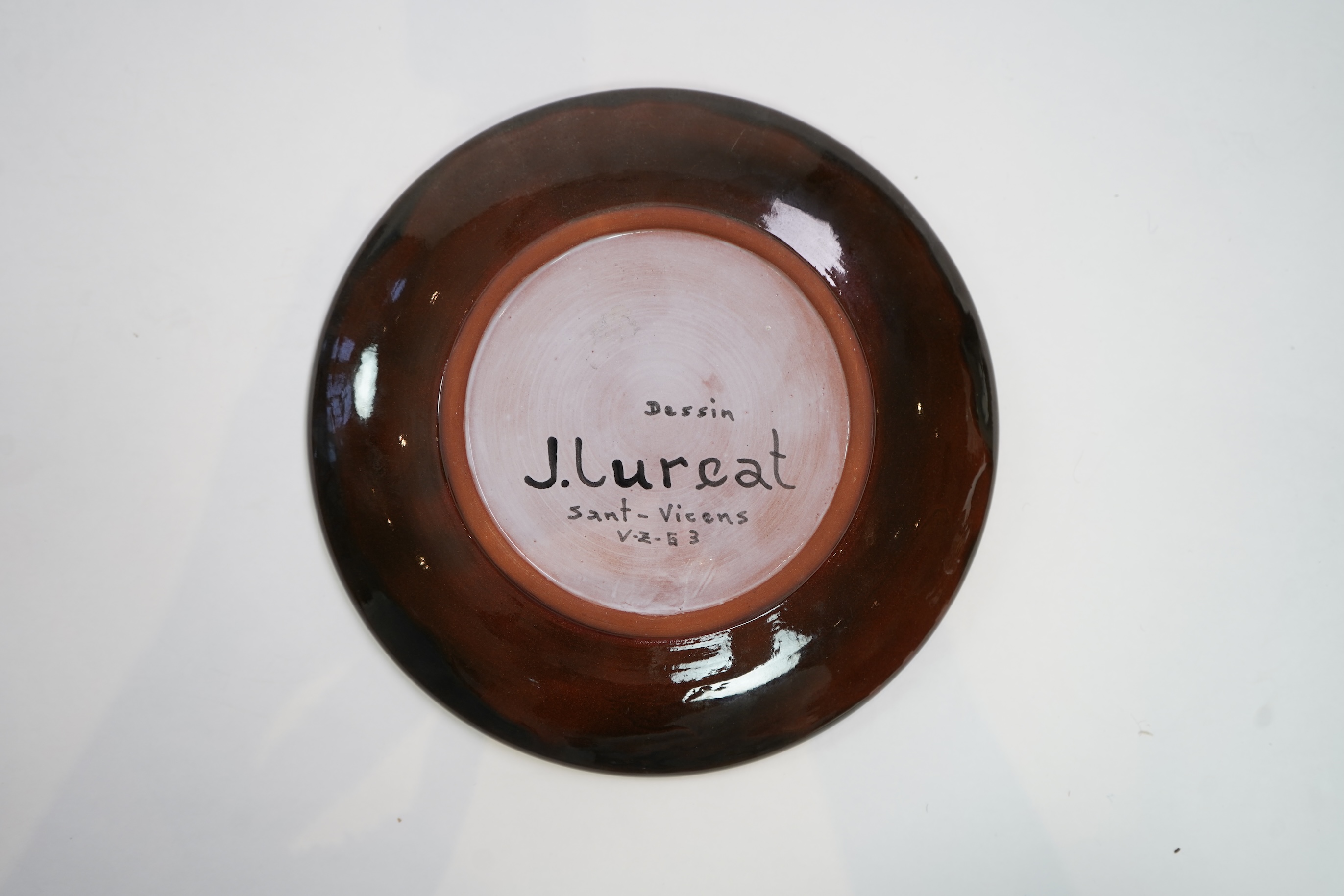 Jean Lurçat (1892-1966): A brown glazed earthenware plate, decorated with a stylised central figure